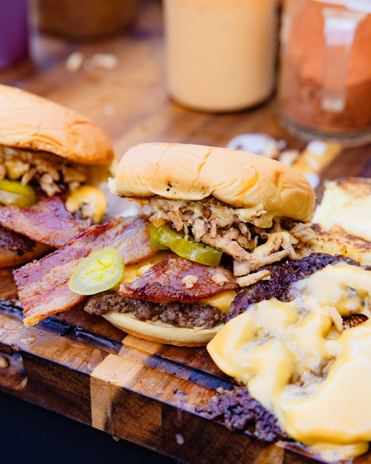 Smash burgers with bacon on a board