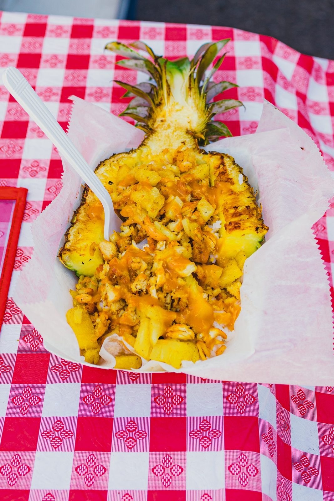 Grilled chicken and rice served in a fresh pineapple