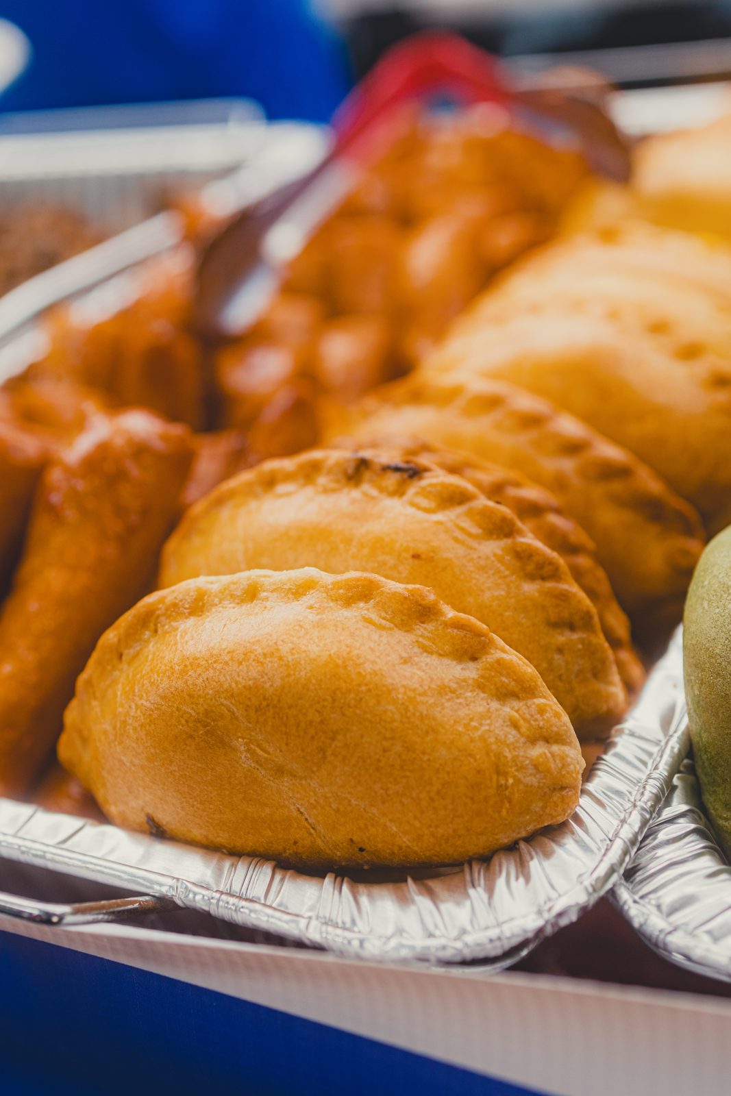 Golden fried empanadas in a tray