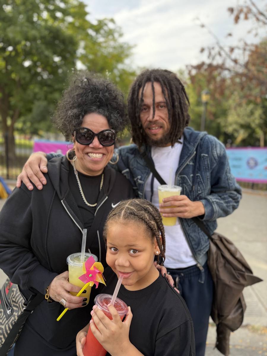 A family with drinks at Bronx Night Market, October 2026